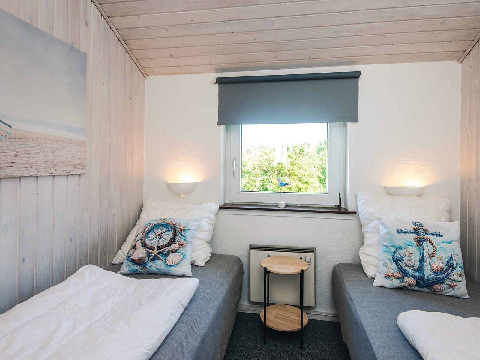 A bedroom with two single beds