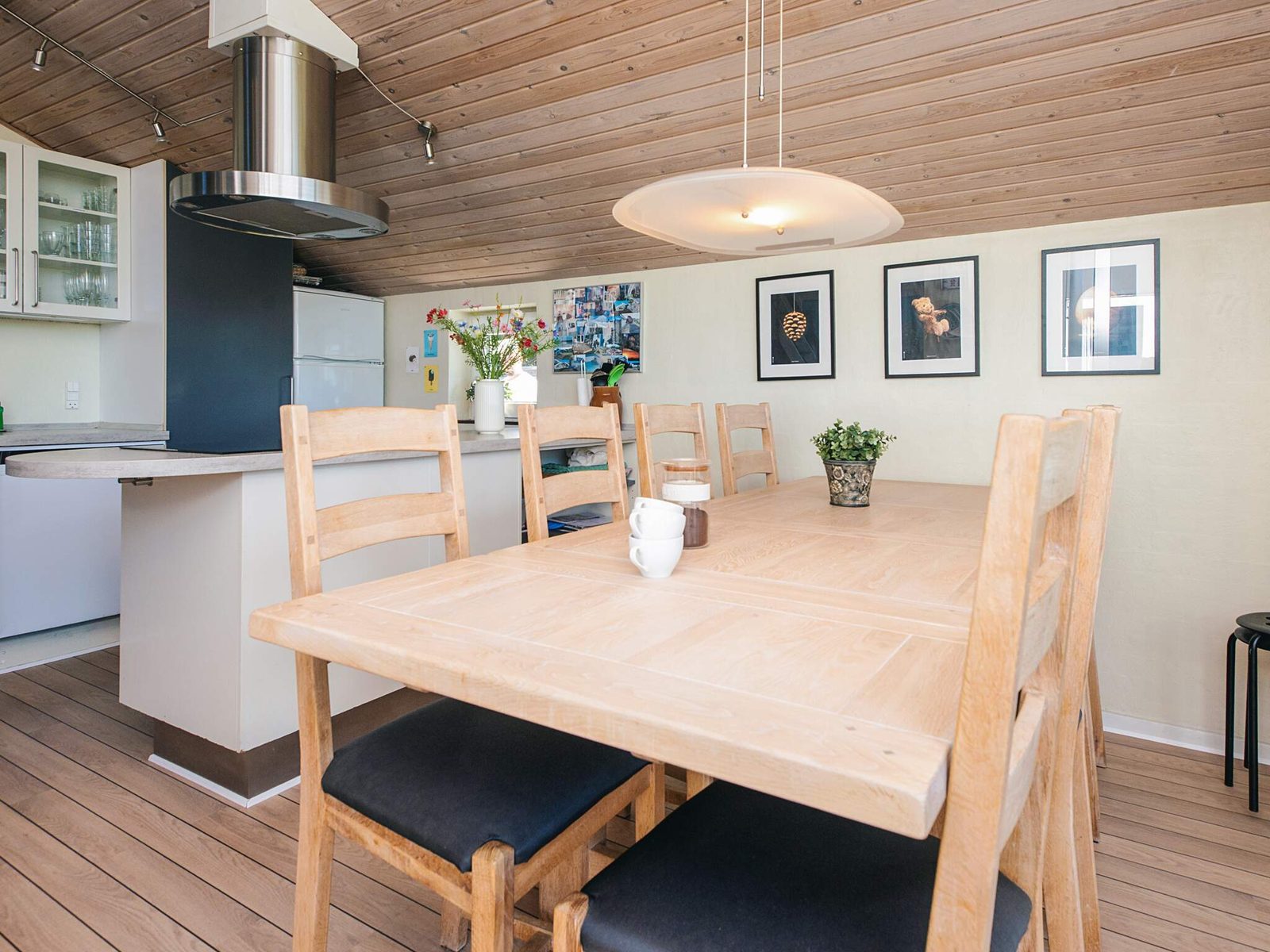 The solid timber dining table, seating the whole party