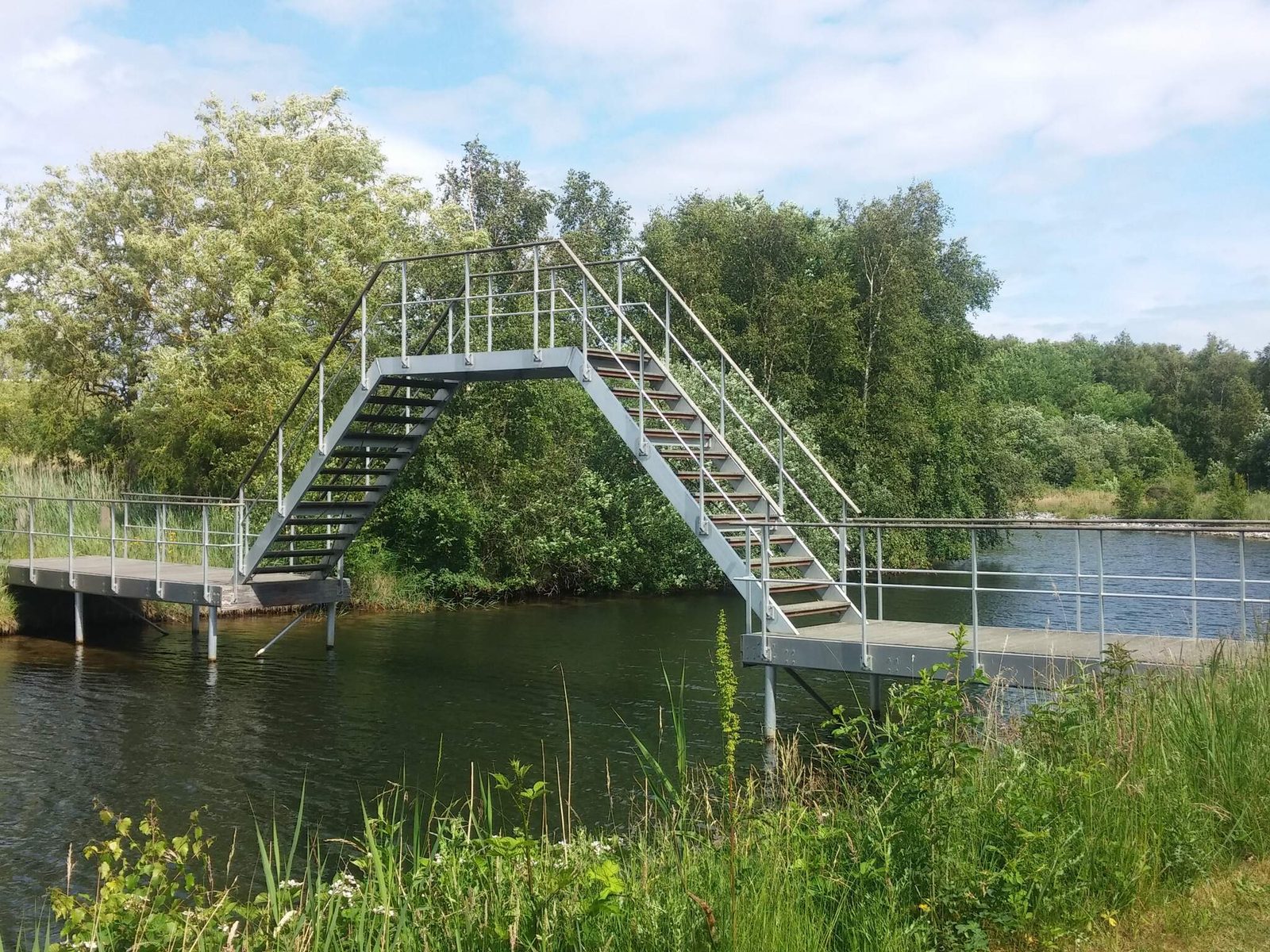 A timber jetty and bathing steps at the water