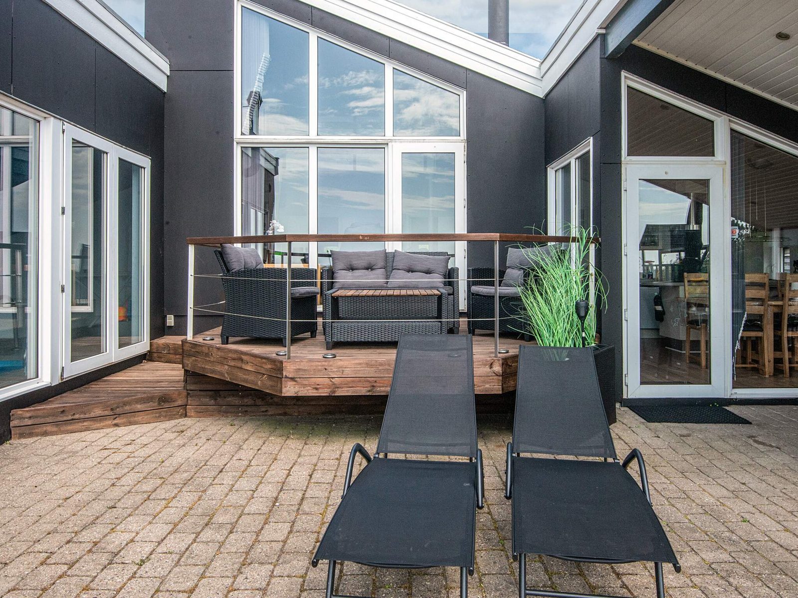 Lounge furniture and sun loungers on the timber deck